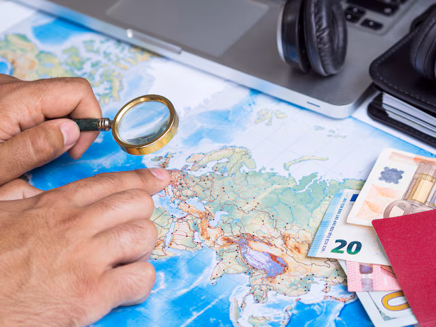 man-looking-map-with-magnifying-glass_23-2148256057